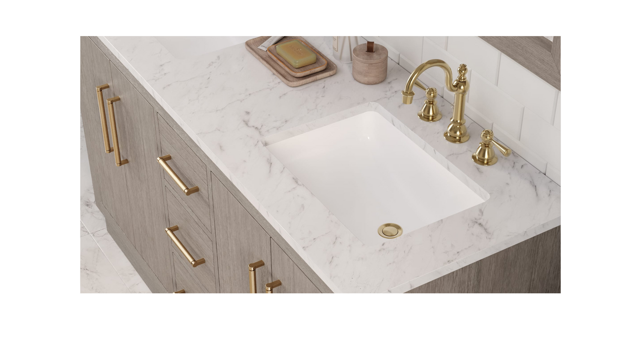 Light wood bathroom vanity with undermount ceramic sink and gold hardware